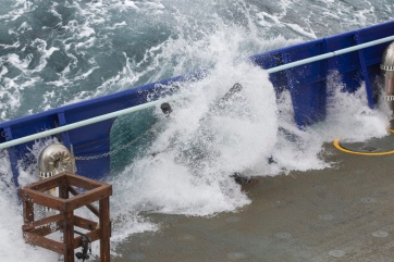 Swells breaking over the working deck.