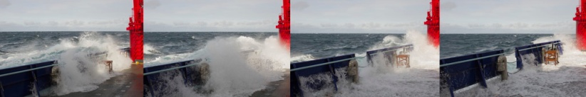 Swells breaking over the Working Deck.